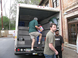 Loading truck to return beer to store.